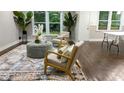 Inviting living room with elegant furnishings, large windows, and hardwood floors at 4296 Langdon Dr, Decatur, GA 30035