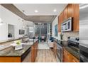Modern kitchen with granite countertops, stainless steel appliances, and city views at 855 Peachtree Ne St # 1508, Atlanta, GA 30308
