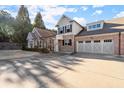 Attractive home featuring a spacious three-car garage with ample driveway at 2797 Middlecreek Way, Cumming, GA 30041