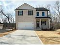 Attractive 2-story home with brick front, two-car garage, and concrete driveway at 5110 Black Bear Trl, Douglasville, GA 30135