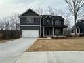Beautiful two-story home featuring a two-car garage and a well-manicured front lawn at 5547 Bent Grass Way, Douglasville, GA 30135