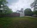 Spacious backyard, partly fenced, offering ample outdoor space and privacy at 1228 Ladd Sw St, Atlanta, GA 30310