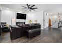 Inviting living room featuring hardwood floors, a modern fireplace, and an open concept design at 1228 Ladd Sw St, Atlanta, GA 30310