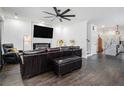 Spacious living room with dark hardwood floors, a sleek fireplace, and modern lighting at 1228 Ladd Sw St, Atlanta, GA 30310