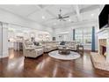 Spacious living room featuring a coffered ceiling, fireplace, and open layout connected to the gourmet kitchen at 1974 Hosack Sw Hl, Marietta, GA 30064