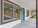 Inviting covered front porch featuring a bright blue door, white siding, and neutral trim, perfect for enjoying quiet moments at 3216 Montheath Ct, Duluth, GA 30096
