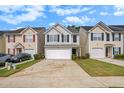 Attractive two-story home with a one-car garage and driveway parking at 50 Fieldview Ln, Covington, GA 30016