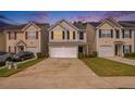 Charming two-story home with a one-car garage and driveway parking at 50 Fieldview Ln, Covington, GA 30016
