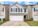 Charming two-story home featuring a one-car garage and beautifully maintained front yard at 50 Fieldview Ln, Covington, GA 30016