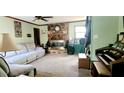 Cozy living room with a stone fireplace and neutral-toned walls at 2579 Country Club Dr, Conyers, GA 30013