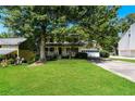 Inviting two-story home with a classic front porch and a lush green lawn at 3391 Quail Hollow Trl, Snellville, GA 30039