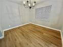 Cozy bedroom with a large window and modern flooring at 5464 Fox Haven Trl, Stone Mountain, GA 30088