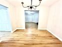 Bright dining area with updated flooring and a stylish chandelier at 5464 Fox Haven Trl, Stone Mountain, GA 30088