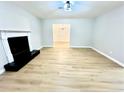 Spacious living room featuring modern flooring and a cozy fireplace at 5464 Fox Haven Trl, Stone Mountain, GA 30088