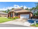 The exterior features well-maintained landscaping and a two-car garage at 1480 Shady Cove Ln, Lawrenceville, GA 30043