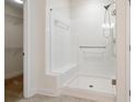 Bathroom with a glass-enclosed shower, built-in bench, and modern fixtures at 2561 Grapevine Cir # 104, Cumming, GA 30041