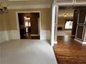 Open-concept view from the dining room, showing hardwood floors and access to the adjoining living spaces at 3360 Keenland Rd, Marietta, GA 30062