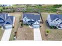 Aerial view of the property showcasing the home, yard, and surrounding neighborhood with privacy fence in the backyard at 4607 Underwood Walk, Powder Springs, GA 30127