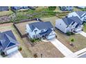 Birds-eye view of the property, highlighting the house, lawn, landscaping, privacy fence and surrounding neighborhood at 4607 Underwood Walk, Powder Springs, GA 30127