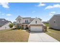 Attractive two-story home featuring brick and white siding, a well-kept front yard, and an attached two-car garage at 4607 Underwood Walk, Powder Springs, GA 30127