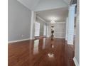 Bright living room with hardwood floors, large windows, and elegant architectural details at 3773 Summer Rose Dr, Atlanta, GA 30341
