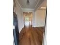 Open foyer with hardwood floors leading to spacious living areas at 4297 Azalea Ridge Way, Hoschton, GA 30548