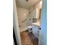 Functional bathroom featuring a shower-tub combo, tiled floors and vanity with sink and drawers at 1040 Forest East Dr, Stone Mountain, GA 30088