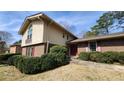 Charming exterior featuring brick accents, and a lush garden at 2886 Thornbriar Rd, Atlanta, GA 30340