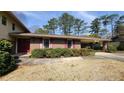 Well-kept single-story home with a covered carport and brick facade at 2886 Thornbriar Rd, Atlanta, GA 30340