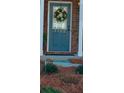 Welcoming front door with a wreath and visible house numbers at 3182 Mill Springs Cir, Buford, GA 30519