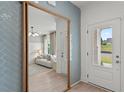 Bright entryway featuring tile accents, wood floors, and a view of the adjacent living room at 400 Beacon Way, Villa Rica, GA 30180