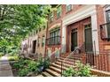 Street view of brick townhomes with well-maintained landscaping and charming architectural details at 2548 Crescent Park Ct # 7, Atlanta, GA 30339