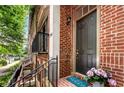 Inviting front entrance with brick facade, elegant door, and a 