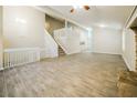 Open-concept living space with tile flooring, staircase, and natural light at 8607 Wood Springs Ct, Douglasville, GA 30135