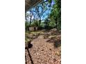 Spacious backyard with mature trees and a storage shed at 214 Upshaw Sw St, Atlanta, GA 30315