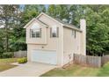 Charming two-story home featuring an attached garage and well-maintained front yard at 503 Fable Ln, Canton, GA 30114