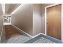 Hallway featuring neutral tones, modern lighting, and carpeted flooring at 3300 Windy Ridge Se Pkwy # 1107, Atlanta, GA 30339