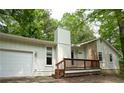 A charming single Gathering home featuring a front porch, stone accents, and an attached garage at 3963 Ferncliff Rd, Snellville, GA 30039