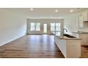 Open kitchen area with stainless steel sink and hardwood floors at 1958 Asher Ln # 50, Conyers, GA 30013