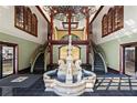 Grand lobby with a water feature, dual staircases, and elegant lighting at 3334 Peachtree Ne Rd # 1609, Atlanta, GA 30326
