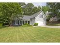 Charming one-story home featuring a well-manicured lawn, attached garage, and classic curb appeal at 620 Alcovy Springs Dr, Lawrenceville, GA 30045