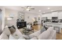 A modern, open-concept living room with hardwood floors and stylish décor at 1023 Merritt Dr # 100, Villa Rica, GA 30180