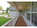 Spacious front porch with wood flooring and white railing offers a welcoming outdoor space at 399 Towler Drs, Loganville, GA 30052