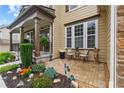 Inviting front porch with stone accents, seating area and lush garden at 155 Edgewater Trl, Canton, GA 30115