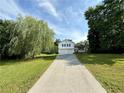 Charming two-story home featuring a front porch, two-car garage, and a long driveway at 23 Jennifer Ln, Rydal, GA 30171