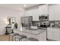 Bright modern kitchen with granite countertops, stainless appliances, and a large island at 50 Leggett Dr # 184, Villa Rica, GA 30180
