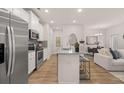 Beautiful modern kitchen with stainless appliances, granite countertops and seating at the kitchen island at 50 Leggett Dr # 184, Villa Rica, GA 30180