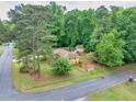 An aerial view showcasing the layout and spacious backyard of this charming brick home at 519 Beaver Ruin Nw Way, Lilburn, GA 30047