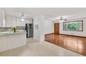 Inviting living area with stainless steel appliances, refinished hardwood floors, and ample natural light at 519 Beaver Ruin Nw Way, Lilburn, GA 30047