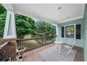 Inviting front porch with seating area and a view of the lush surroundings at 2324 Oakview Ne Rd, Atlanta, GA 30317